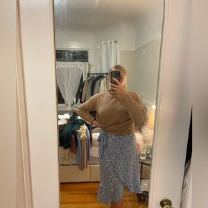 Blue skirt with flowers.